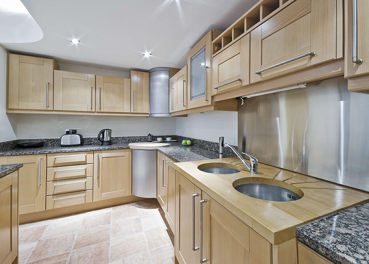 AA Grabite&Marble_kitchen-brown-wooden-kitchen-cabinet-and-black-granite-countertops-also-double-circle-sinks-inviting-details-of-kitchen-and-breakfast-room-design-ideas-offers-amazing-look copy.jpg